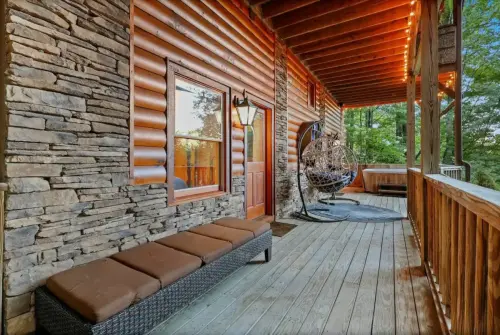 Main level deck with grill, outdoor dining set, chairs and benches to relax and enjoy the incredible sunset view of Grandfather Mountain !